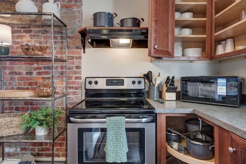 Fully furnished kitchen with appliances and dinner service for 12