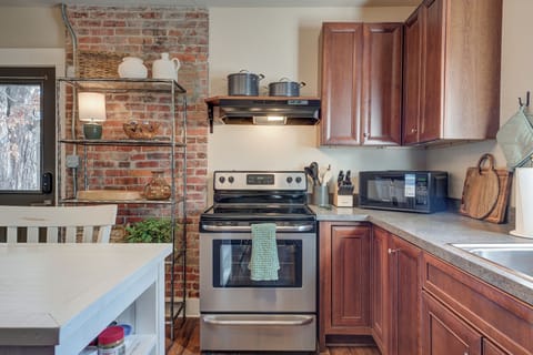 Fully furnished kitchen with appliances and dinner service for 12