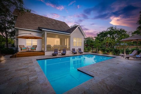 Private swimming pool surrounded by lounge chairs