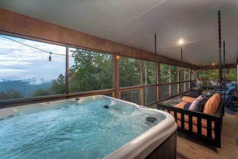 Experience serenity with a dip in our hot tub, surrounded by stunning mountain vistas!