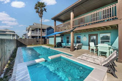 Your private pool oasis awaits with crystal-clear waters and poolside loungers under sunny skies.