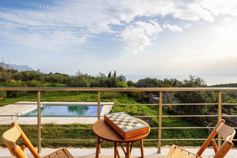 Panoramic views from the balcony – Mountains, olive groves, and sky

