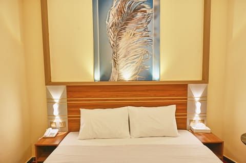 Standard Double Room, City View | Living area | TV