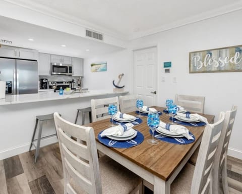 A spacious, open-concept dining area and living room with ample seating for dining and relaxation.