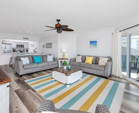 Large family room with plenty of seating for watching TV or playing board games.