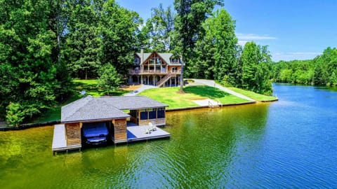 Stunning waterfront retreat with a private dock and serene wooded surroundings.