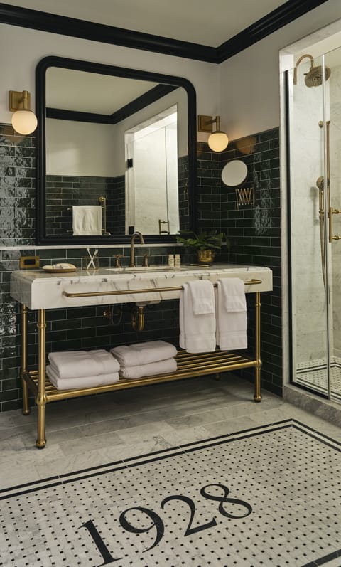 Combined shower/tub, designer toiletries, hair dryer, bathrobes