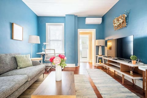 Very cozy living room with plenty of seating options. There is a fold out futon chair on the right that goes completely flat to accommodate a  third guest. 