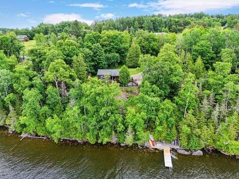 Aerial view of property and lakefront