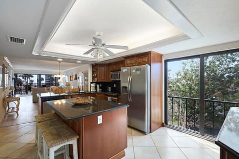 Full kitchen with stainless steel appliances.