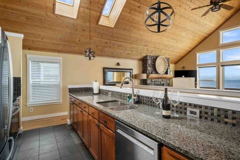 The kitchen is spacious and efficient. Perfect place to prepare a family meal or a quick treat. Grab some seafood and have fun!