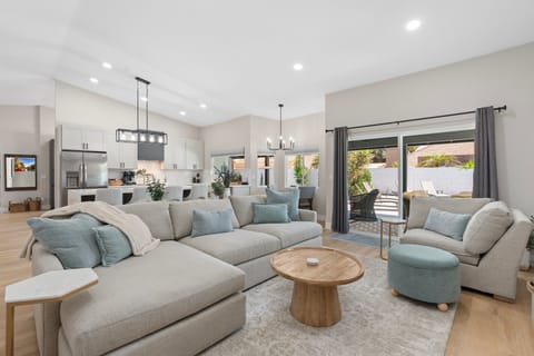Stylish dining area with views of the kitchen and living room.
