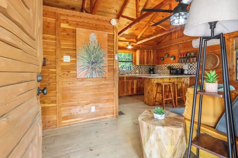 View from the front door looking into the cabin. The kitchen can be seen directly ahead and to the right.