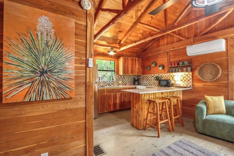 Walking toward the kitchen.