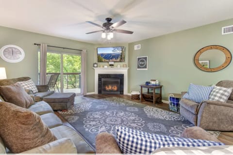 Two Bedroom Pigeon Forge Vacation Condo Rental Cedar Lodge 102 n - Spacious Living Room with Gas Fireplace, Sleeper Sofa and SMART TV with Cable & WIFI throughout vacation rental