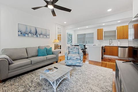 Comfy living room, pull out couch, ceiling fan, 65” SMART HDTV