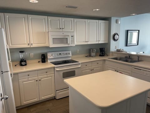 Kitchen Appliances: Oven/Stove Top, Microwave, Refrigerator, and Dishwasher