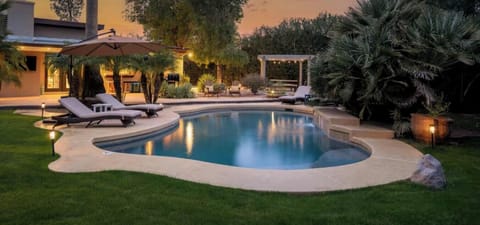 Large Heated Pool with Waterfall Feature (pool barrier safety fence)