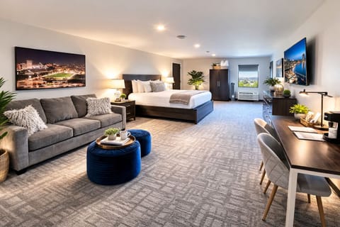 A bright and inviting room with a comfortable bed, soft linens, and ample natural light for a restful experience.