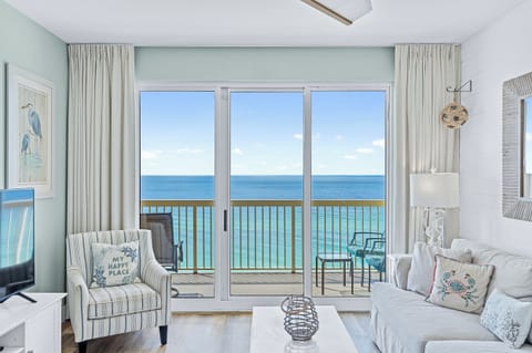 Unwind in your private coastal retreat with stunning ocean vistas through floor-to-ceiling windows. Step onto your balcony to breathe in salty breezes while turquoise waves create a soothing soundtrack.