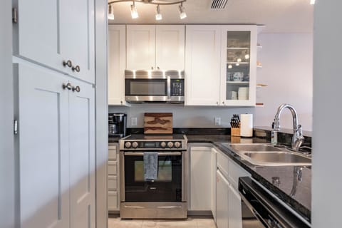 Full Kitchen Upgraded High End Appliances Granite Counter Tops Pantry on Left and Plenty of Cabinets Fully Stocked