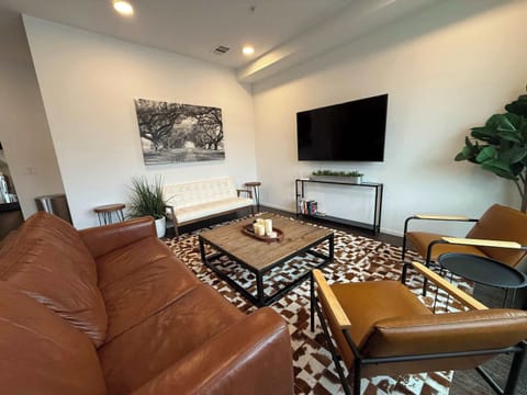 Curl up in the chic living room & stream your favorites on the smart TV