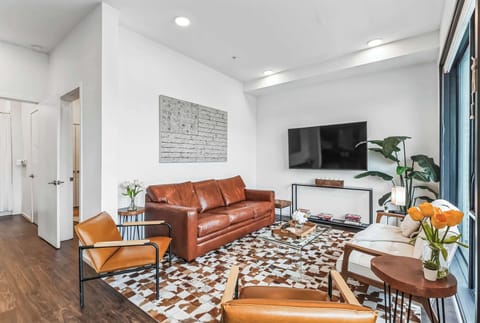 Unwind in the stylish living room & stream your favorites on the smart TV