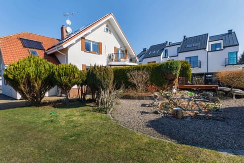 An exterior view of the property, showcasing a spacious garden and picturesque surroundings.
