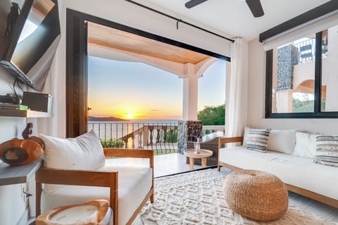 View from living area out toward the balcony and ocean