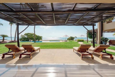 Ground floor terrace with stunning ocean views—just steps from the beach and made for unforgettable sunsets