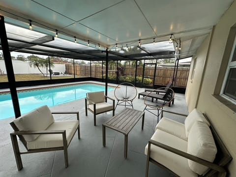 Enjoy this completely furnished and enclosed pool patio!