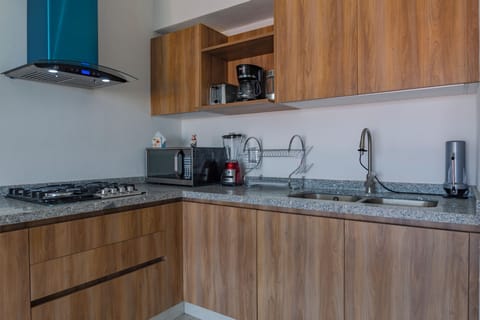 Deluxe Apartment, Balcony, Pool View | Private kitchen | Electric kettle