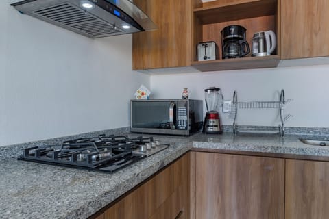 Deluxe Apartment, Balcony, Pool View | Private kitchen | Electric kettle
