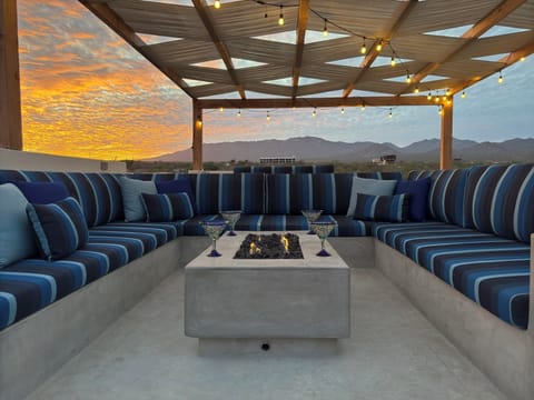 Snuggle up on the rooftop with comfy seating, breathtaking views, and a fire table for cooler nights (1)