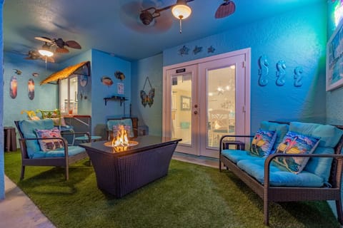 Relax on the lanai by the pool next to the Tiki bar and pass thru window