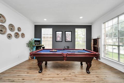 The game room have a classic pool table with all needed cues, two arcade game, wide window view and hours of fun with your friends or family.
