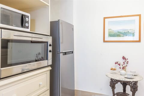 Villa | Private kitchen | Fridge, microwave, oven, stovetop