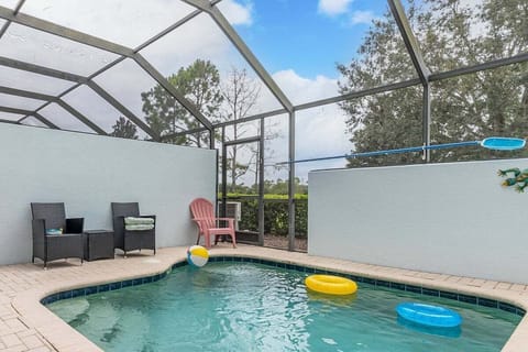 Enjoy the privacy of your own screened-in pool area, complete with lounge chairs and fun pool toys. Perfect for unwinding under the sun or stargazing.