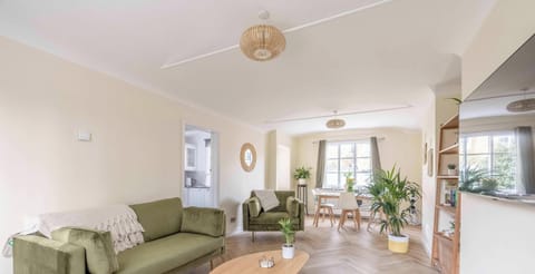 Filled with natural light and an open feel, this living room offers a refreshing space to unwind, whether you're catching up on your favorite shows or simply enjoying a quiet moment