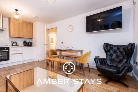 A bright and cozy living room with comfortable seating, soft lighting, and a welcoming atmosphere perfect for relaxing or socializing.