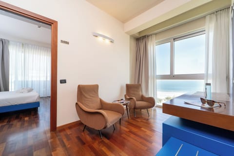 Superior Quadruple Room | Living area | TV