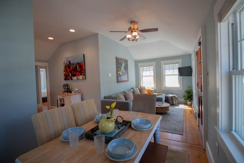 Sunlight pours into this spacious, light-filled home with high ceilings, hardwood floors, and coastal charm woven into every detail.