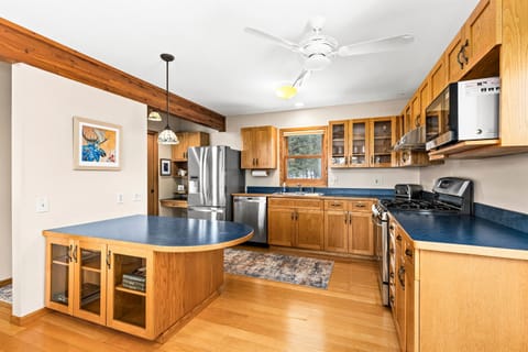 Bright and functional kitchen with a thoughtfully designed layout, featuring modern appliances, ample counter space, and plenty of storage. Perfect for preparing family meals or snacks after a day of North Shore adventures.