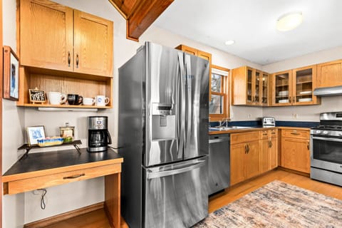 Charming coffee bar area in the kitchen, complete with a dedicated space for brewing your favorite drinks. This inviting nook adds convenience and a touch of warmth, perfect for starting your day or enjoying a quiet moment with a cup in hand