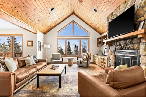 Bright and cozy upstairs living room with large windows framing Lake Superior views. Perfect for relaxing,   gathering and sharing stories of your adventures exploring Minnesota's North Shore. 