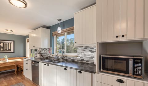 Top-grade appliances and plenty of counter space makes cooking a breeze in this kitchen.