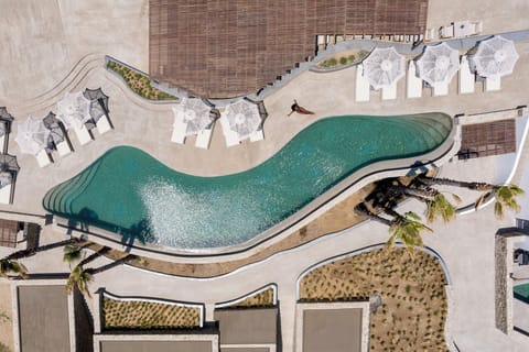 Seasonal outdoor pool, open 10:00 AM to 6:00 PM, pool umbrellas