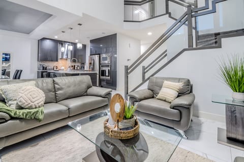 Spacious living area with modern decor and a 55-inch TV for cozy movie nights