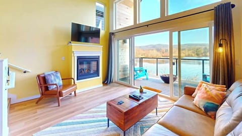 Every home boasts a cozy living room with a queen pull-out sofa bed, a warm gas fireplace, and stunning views of the pond and outdoor fire pit. It’s the perfect spot to catch the morning sunrise and soak in the coastal serenity.