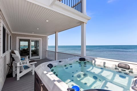 Step out onto the first-floor deck to soak in the sea breeze and take in breathtaking views, complete with your own outdoor bathtub for ultimate relaxation!